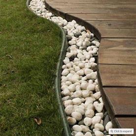 Diy garden border with white marble pebbles
